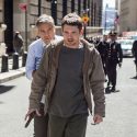 Lee Gates (George Clooney) is held hostage by Kyle Budwell (Jack O'Connell) as police Captain Marcus Powell (Giancarlo Esposito) and his fellow officers follow behind on the streets of New York in TriStar Pictures' MONEY MONSTER.
