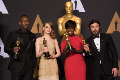 Backstage posing with their Oscars®, Mahershala Ali, Actor in a Supporting Role; Emma Stone, Actress in a Leading Role; Viola Davis, Actress in a Supporting Role; and Casey Affleck, Actor in a Leading Role